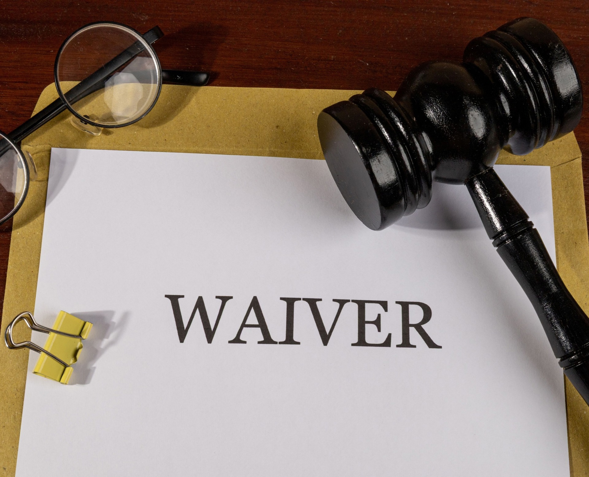 Envelope with a paper that says "Waiver" representing the LexisNexis Fee Waiver