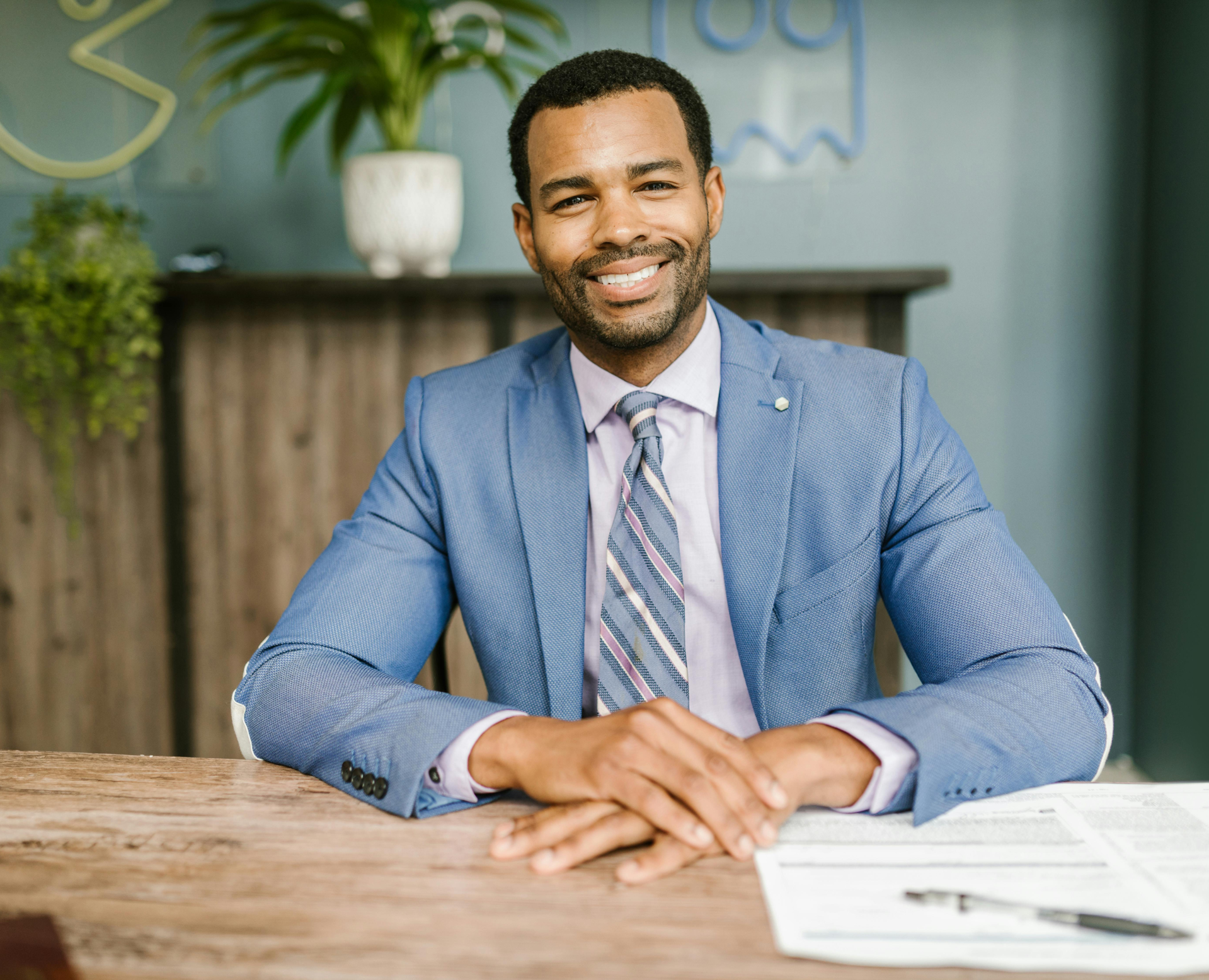 law school admissions employee looking up and smiling at desk