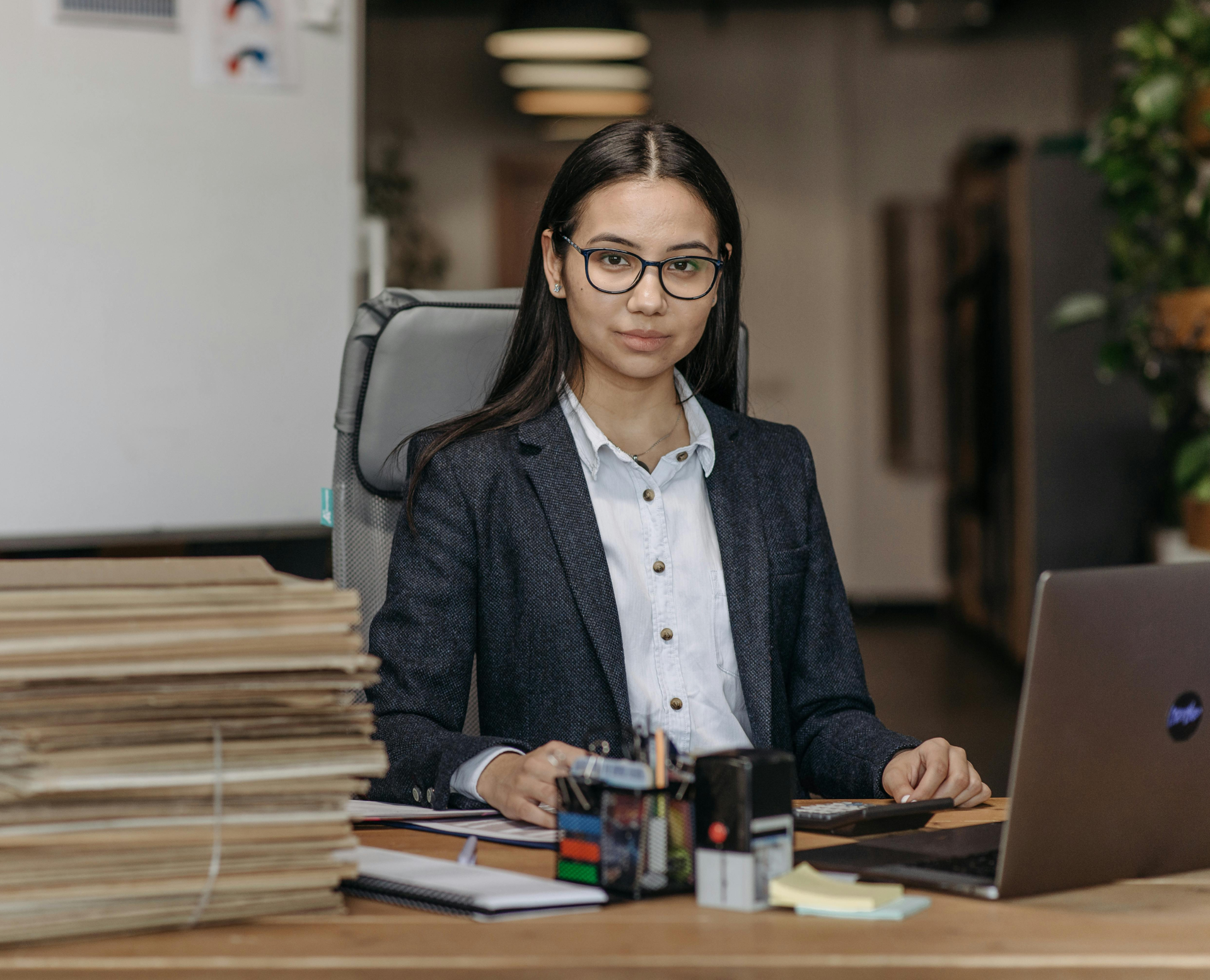 Paralegal looking up from researching JD-Next admission assessment